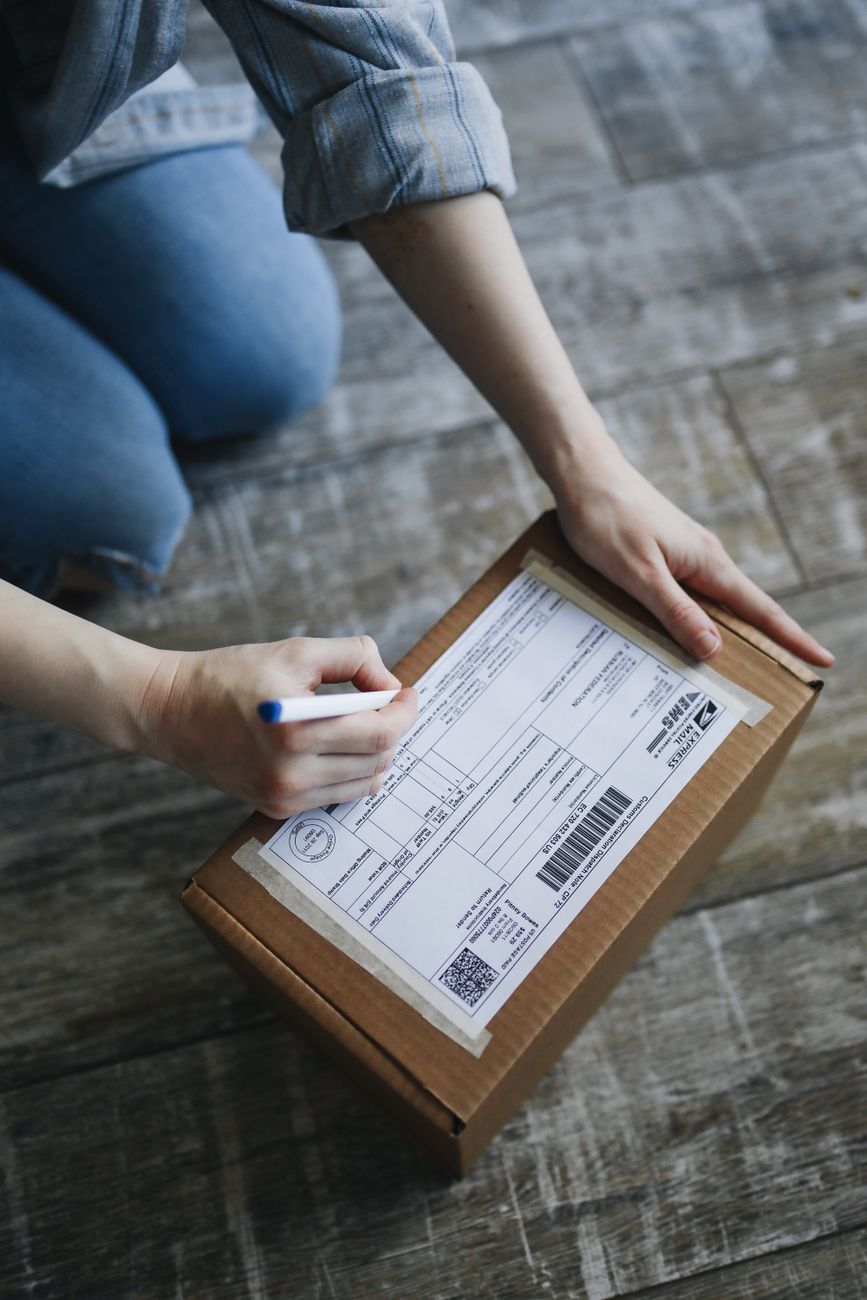 Person holding a clipboard outdoors